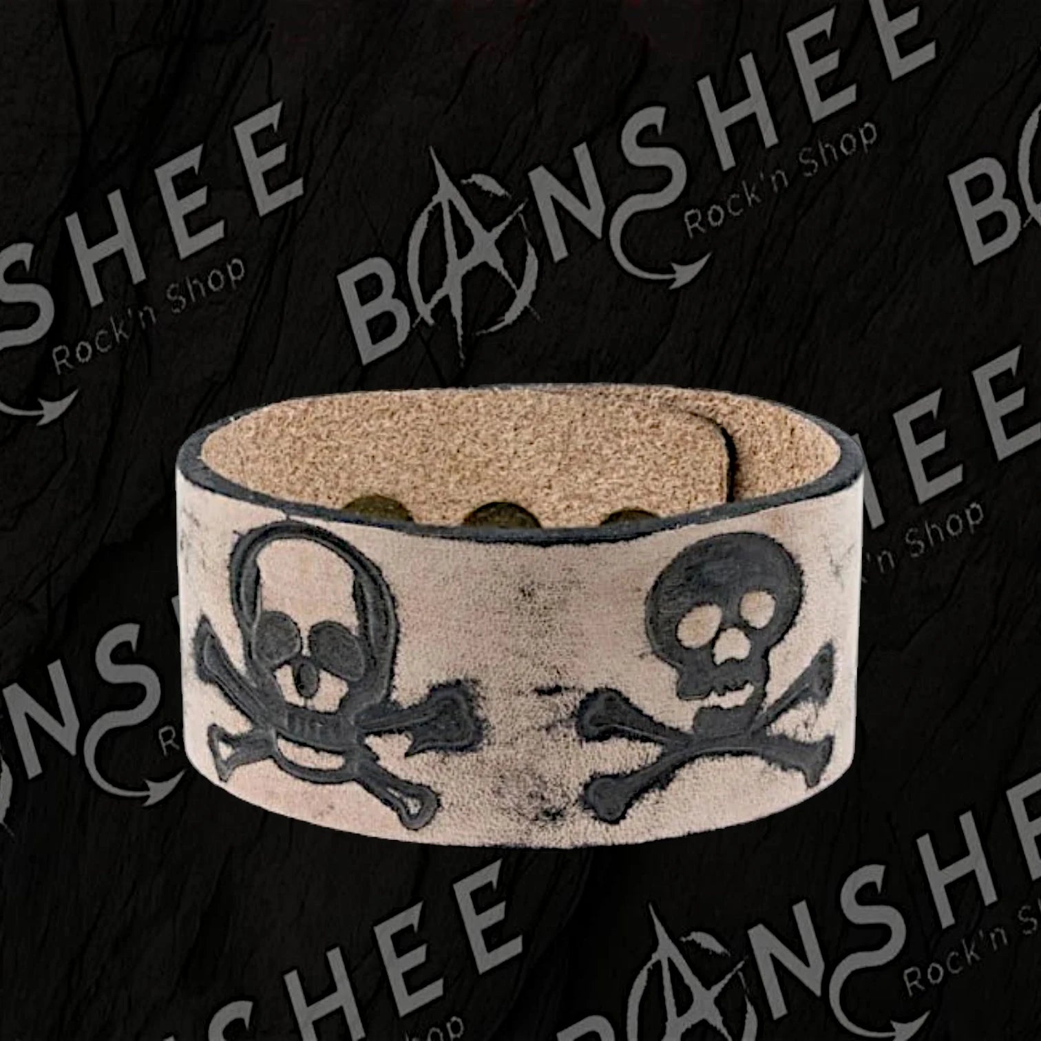 Bracelet en cuir fermé avec têtes de mort et os croisés en relief