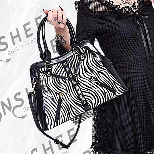 Sac à main zébré noir et blanc avec sangles et rivets